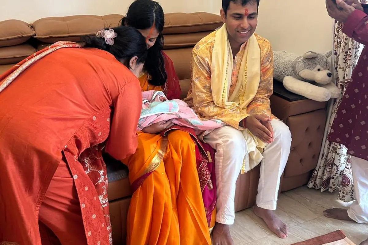 Family participating in a Naamkaran Puja ceremony in Bangalore
